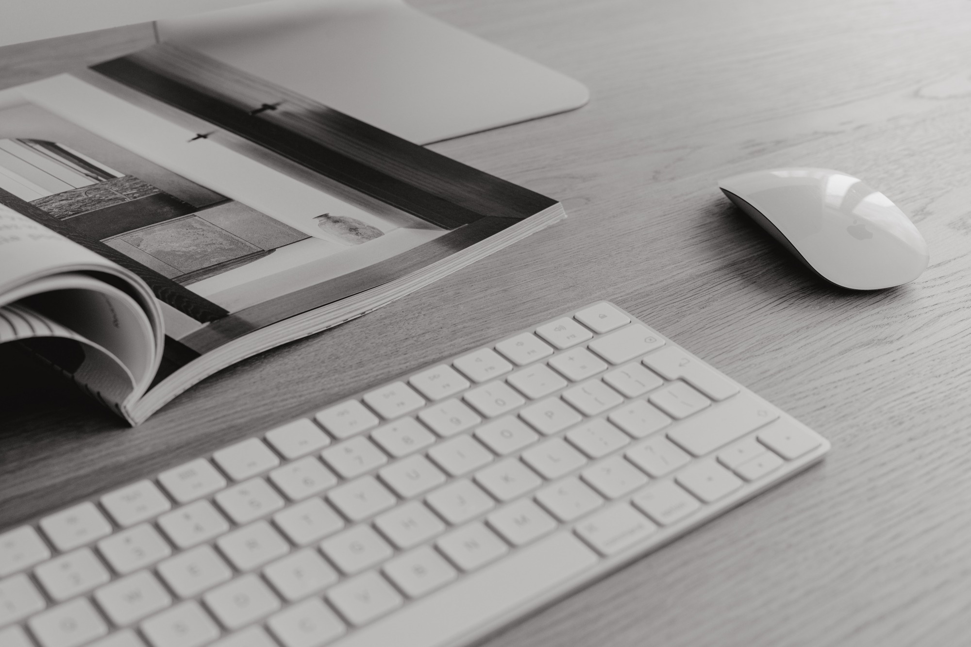Made at Dawn Website Developer | Magazine, Keyboard, and Mouse on a Desk